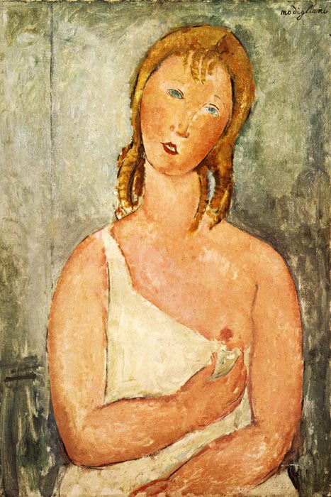 1918 Jeune femme rousse en chemise, assise sur un divan