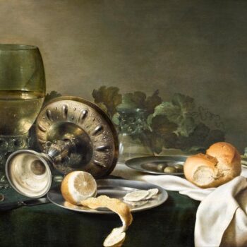 Still life with dishes, bread and lemon